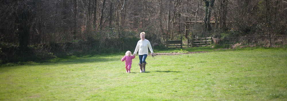 Running across countryside field