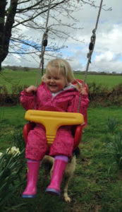 Enjoying the children's play area at Huxtable Farm B&B, West Buckland, Devon