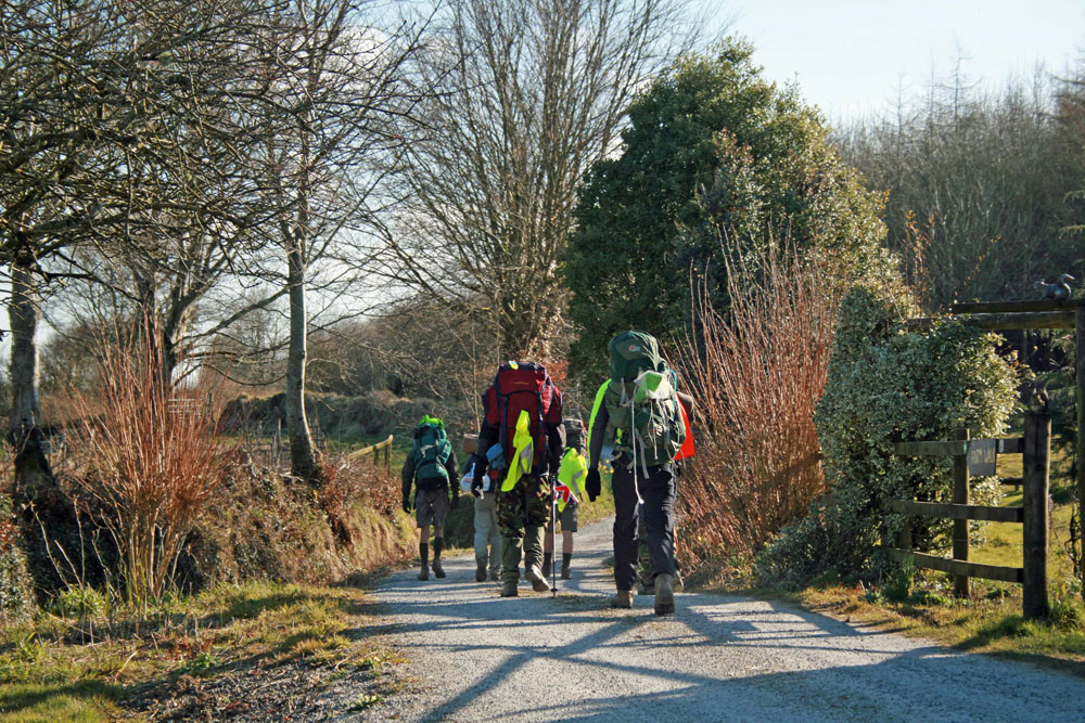 Walkers departing having camped at Huxtable Farm B&B